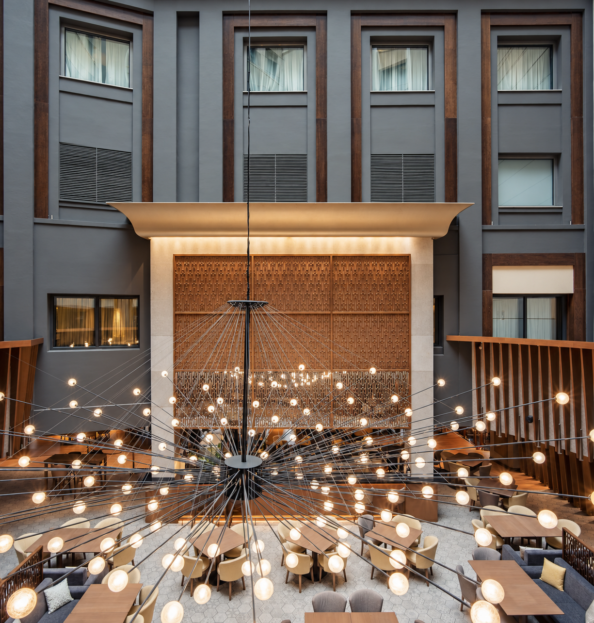 Wyndham Athens — symmetrical atrium and chandelier, photograph 1