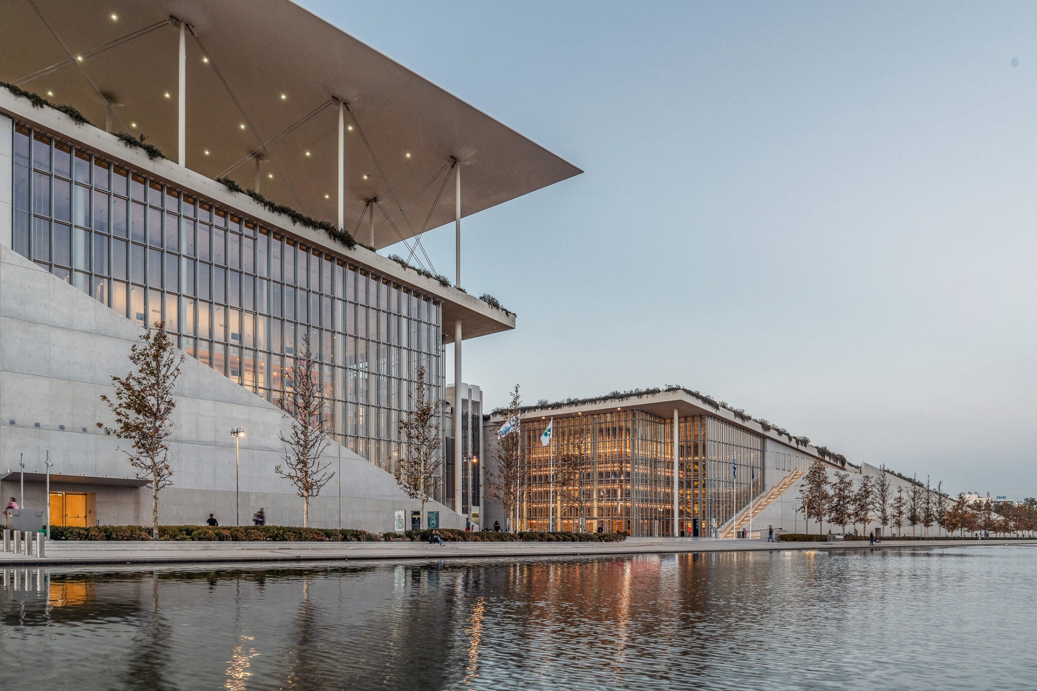Stavros Niarchos Foundation Cultural Center — glass facade and canal reflections