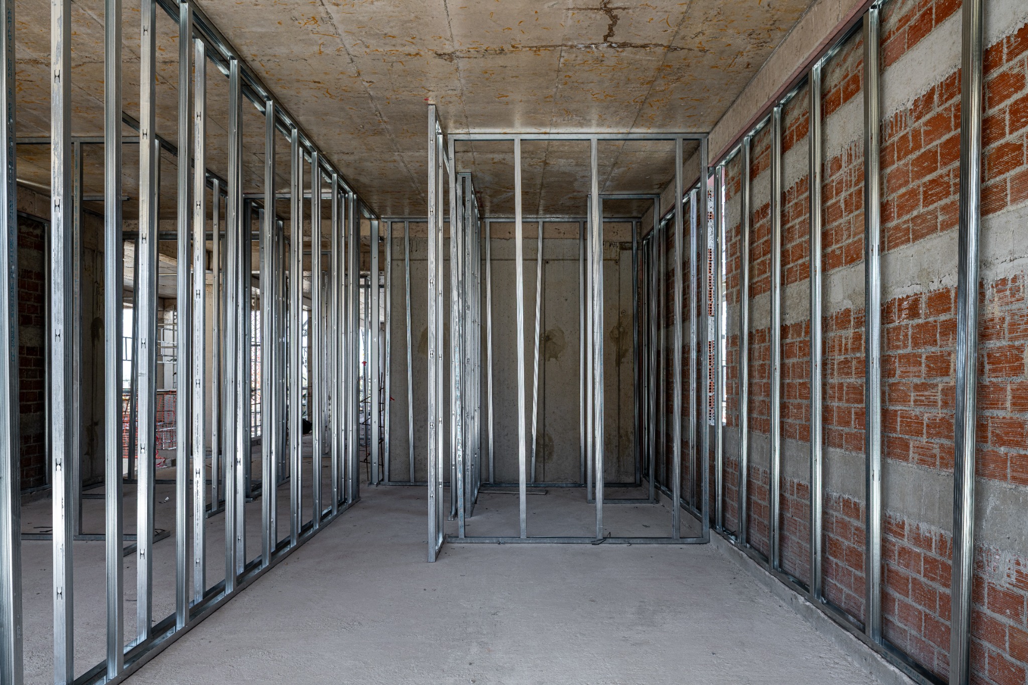 Corridor formed by light-gauge steel wall frames